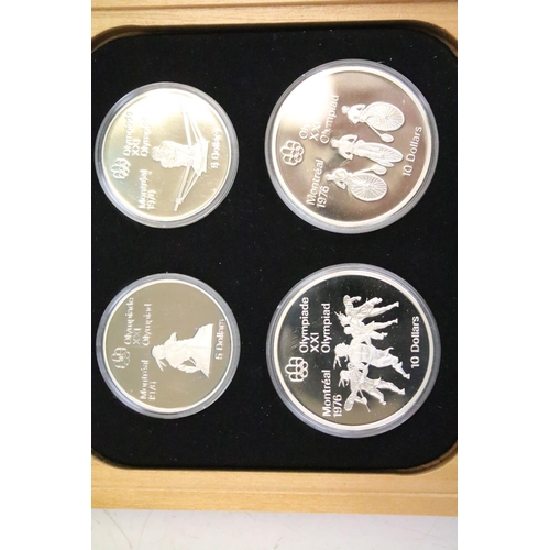 18 - A collection of seven Canada silver proof Olympic coin sets, all within fitted display boxes and com... 