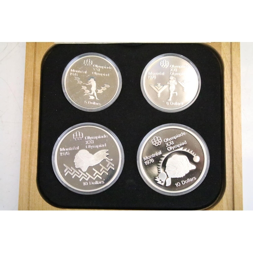 18 - A collection of seven Canada silver proof Olympic coin sets, all within fitted display boxes and com... 