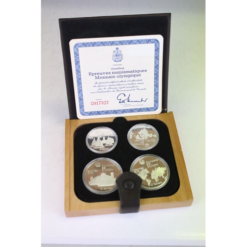 18 - A collection of seven Canada silver proof Olympic coin sets, all within fitted display boxes and com... 