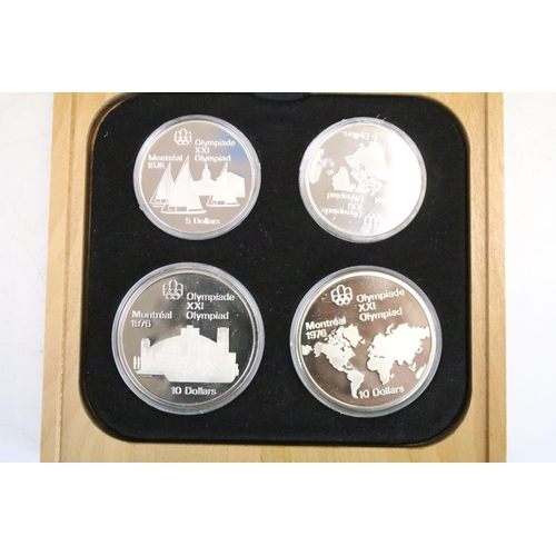 18 - A collection of seven Canada silver proof Olympic coin sets, all within fitted display boxes and com... 