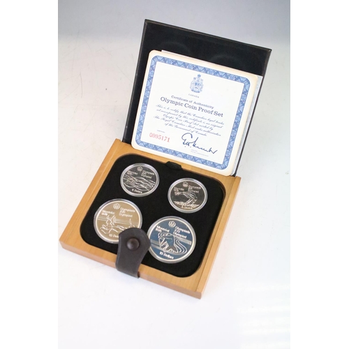 18 - A collection of seven Canada silver proof Olympic coin sets, all within fitted display boxes and com... 