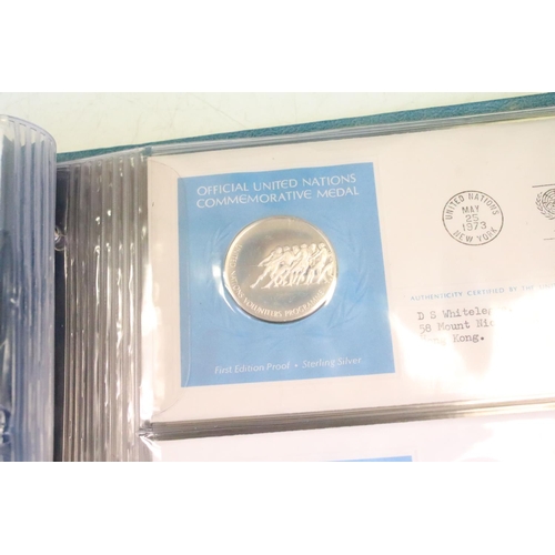 19 - A collection of ten United Nations silver proof coin covers contained within three albums.