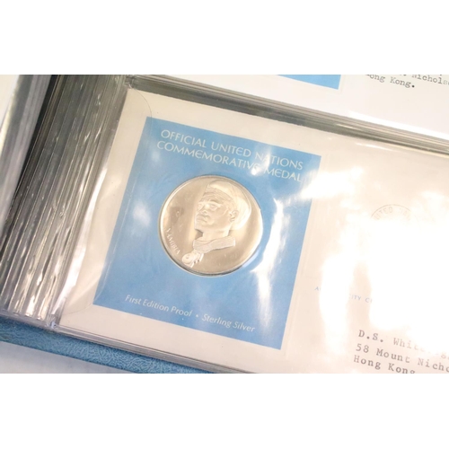 19 - A collection of ten United Nations silver proof coin covers contained within three albums.