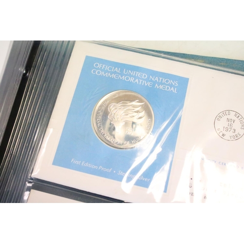 19 - A collection of ten United Nations silver proof coin covers contained within three albums.