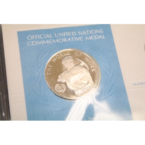 19 - A collection of ten United Nations silver proof coin covers contained within three albums.