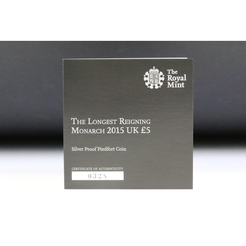 113 - A collection of four Royal Mint United Kingdom silver proof £5 / Five Pound coins to include 2016 90... 