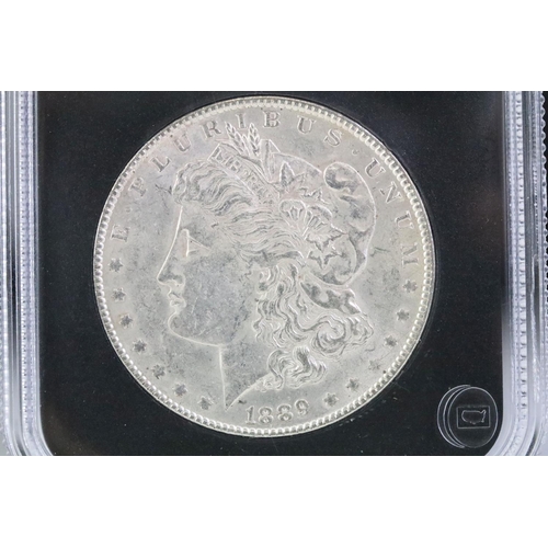 75 - An uncirculated slab mounted 1889 United States Morgan dollar.