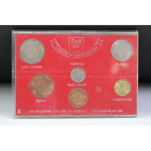 76 - A collection of seven mounted coin sets to include 1967 Coinage of G.B., 1965 EIIR set, Farewell to ... 