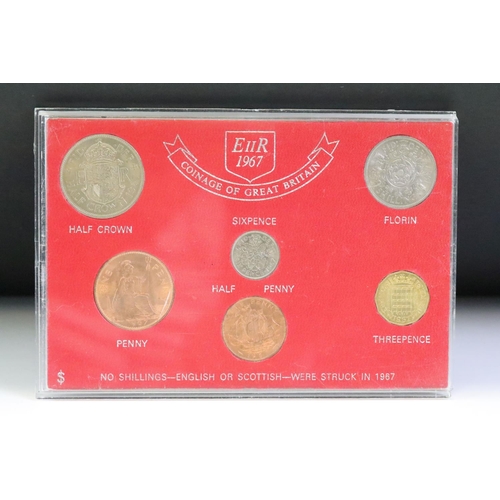 76 - A collection of seven mounted coin sets to include 1967 Coinage of G.B., 1965 EIIR set, Farewell to ... 