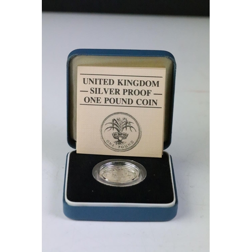 237 - A collection of Royal Mint United Kingdom silver proof coins to include 1988 £1 coin, 1985 £1 coin, ... 