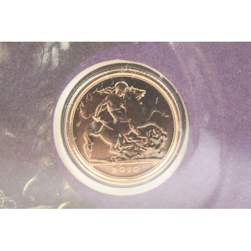 244 - A Westminster Mint 2010 gold quarter sovereign presentation coin cover together with a 2010 George &... 