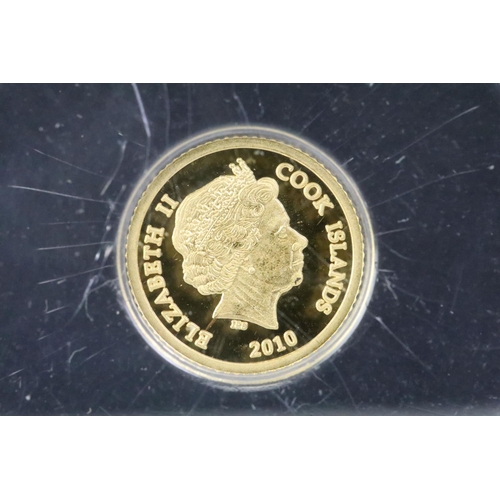 244 - A Westminster Mint 2010 gold quarter sovereign presentation coin cover together with a 2010 George &... 