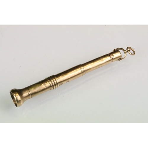 153 - 9ct gold cigar piercer having banded detailing. Hallmarked Birmingham 1910. Measures 8.3cm.