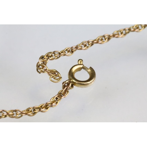 164 - Hallmarked 9ct gold St Christopher pendant of round form mounted to a gold rope twist chain (a/f, ca... 