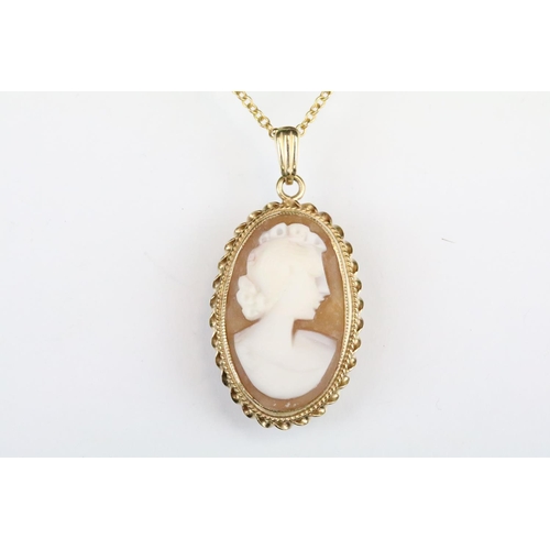 165 - Hallmarked 9ct gold cameo pendant with carved shell cameo, mounted to a 9ct gold chain. Pendant hall... 