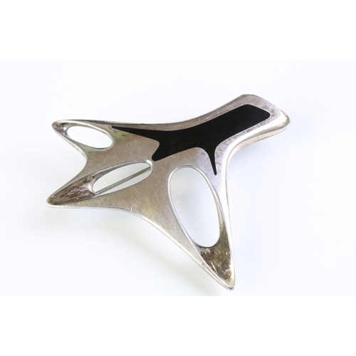 21 - Henning Koppel for Georg Jensen silver and enamel brooch of pierced abstract form with black enamel ... 