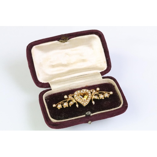 22 - 19th Century Victorian gold, citrine and split pearl heart brooch. The brooch having a mixed cut hea... 