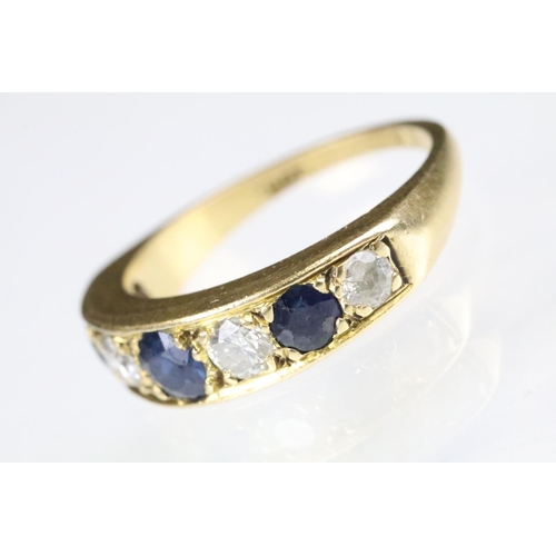 23 - 18ct gold sapphire and diamond seven stone ring set with three round cut sapphires and four round cu... 