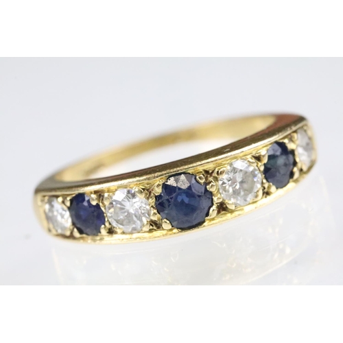 23 - 18ct gold sapphire and diamond seven stone ring set with three round cut sapphires and four round cu... 