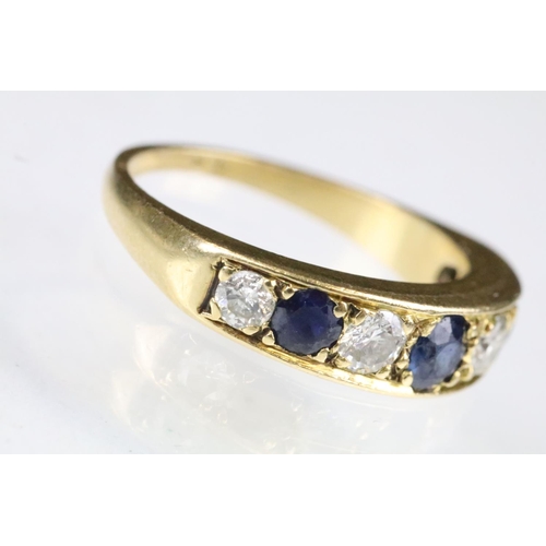 23 - 18ct gold sapphire and diamond seven stone ring set with three round cut sapphires and four round cu... 