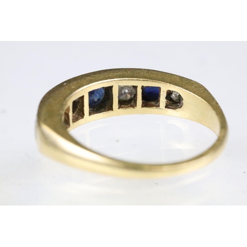 23 - 18ct gold sapphire and diamond seven stone ring set with three round cut sapphires and four round cu... 