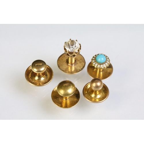 233 - Four yellow metal dress studs and one gold plated example. Yellow metal example one set with a round... 