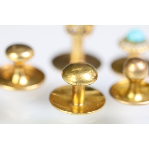 233 - Four yellow metal dress studs and one gold plated example. Yellow metal example one set with a round... 