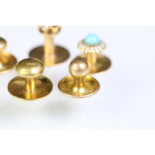 233 - Four yellow metal dress studs and one gold plated example. Yellow metal example one set with a round... 