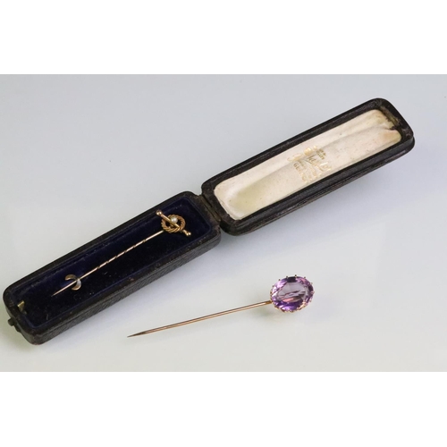 234 - Late 19th Century Victorian amethyst and gold stick pin being set with a large oval mixed cut amethy... 