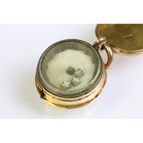 235 - 19th Century Victorian gaming dice spinner pendant being gold cased and housing three miniature dice... 