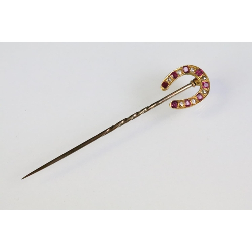 24 - 19th Century Victorian horseshoe stick pin, the finial being set with alternating rectangular cut ru... 