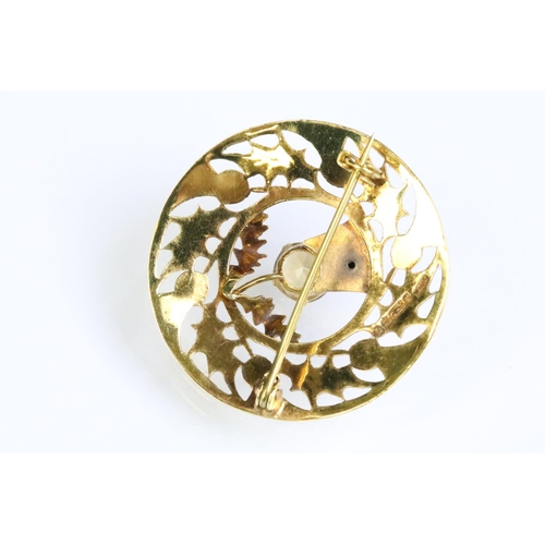 246 - 9ct gold and citrine Scottish thistle brooch of round form with pierced detailing (hallmarked Edinbu... 