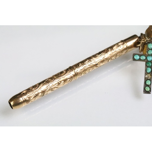 247 - 9ct gold hallmarked mechanical pencil having three charms attached to bale including an 800 silver a... 