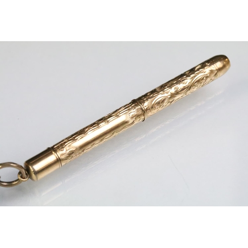 247 - 9ct gold hallmarked mechanical pencil having three charms attached to bale including an 800 silver a... 