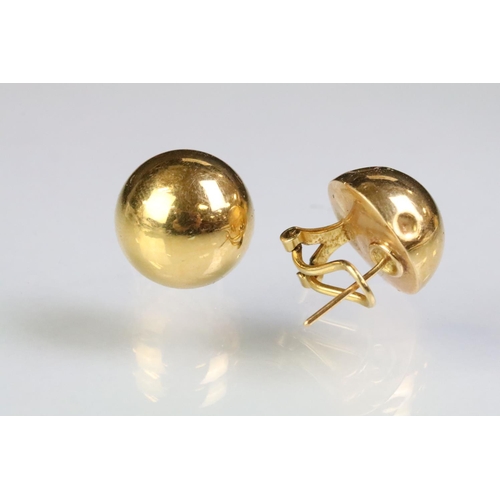 253 - Pair of 18ct gold lever back stud earrings having half dome heads. Marked 750. Measures 1.5cm diamet... 