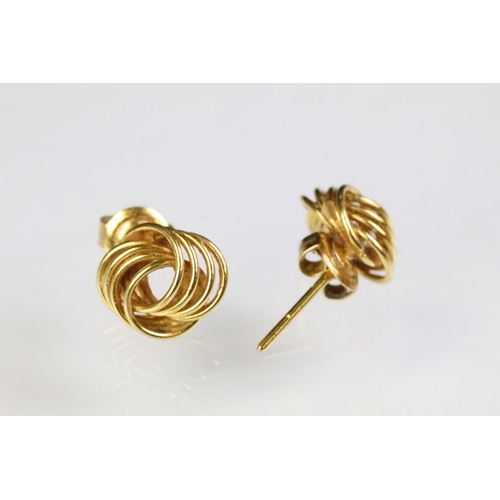 255 - Pair of 18ct gold knot design stud earrings (backs marked 750), a pair of gypsy hoop earrings (unmar... 