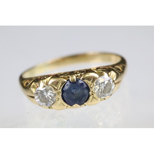 36 - 18ct gold sapphire and diamond boat head ring. The ring being set with a round cut sapphire to the c... 