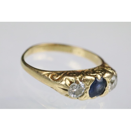 36 - 18ct gold sapphire and diamond boat head ring. The ring being set with a round cut sapphire to the c... 