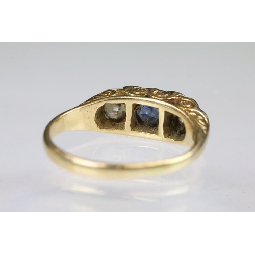 36 - 18ct gold sapphire and diamond boat head ring. The ring being set with a round cut sapphire to the c... 