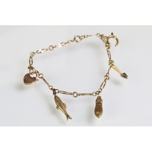 180 - 9ct gold charm bracelet with five charms together with four 9ct charms and a 9ct gold bar brooch set... 