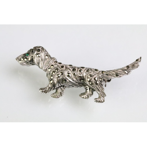 182 - Two Art Deco marcasite set brooches to include a dog brooch with a green stone eye (marked platinin)... 