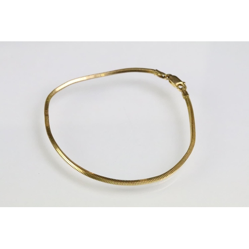 186 - Three bracelets to include a 9ct gold snake chain bracelet (hallmarked Birmingham), a fine rope twis... 