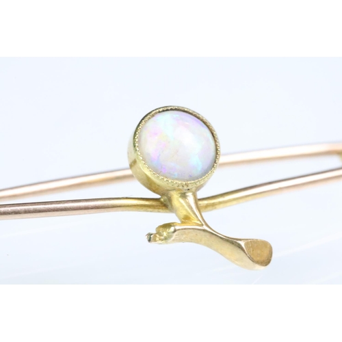 187 - Antique opal and gold safety pin brooch having a round opal cabochon set to the centre. Unmarked, as... 