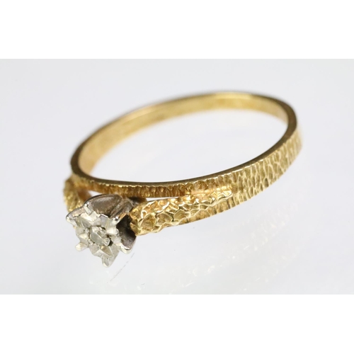 197 - 1970s vintage 18ct gold diamond solitaire ring being illusion set with a single cut diamond on textu... 