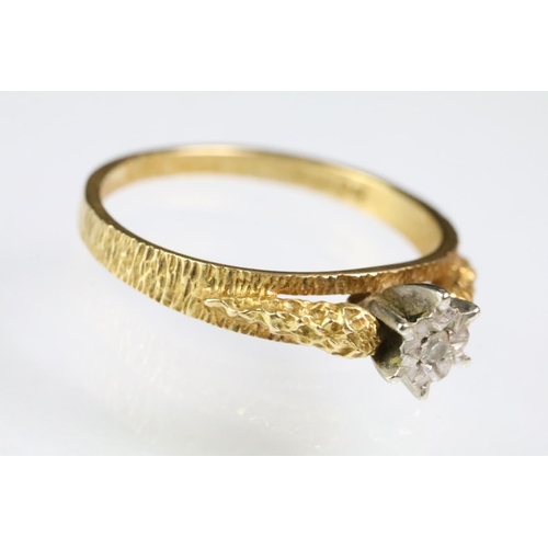 197 - 1970s vintage 18ct gold diamond solitaire ring being illusion set with a single cut diamond on textu... 