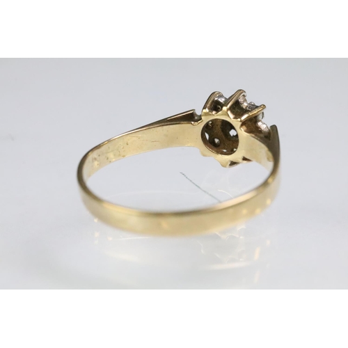 199 - 9ct gold hallmarked sapphire and white stone cluster ring (hallmarked Birmingham 1986, size Q), and ... 