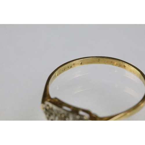 200 - Two 18ct gold rings to include an 18ct gold and platinum diamond set panel ring (marked 28ct & plat,... 