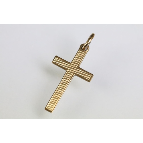 215 - Collection of gold charms to include a 9ct gold hallmarked cross, 14ct gold enamelled flag charm (ma... 