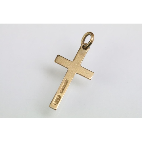 215 - Collection of gold charms to include a 9ct gold hallmarked cross, 14ct gold enamelled flag charm (ma... 