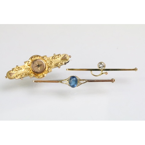 218 - Three antique 9ct gold bar brooches to include a Edwardian Etruscan revivial mourning brooch (hallma... 